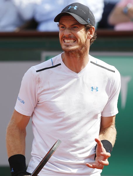 Britain's Andy Murray grimaces as he plays Switzerland's Stan Wawrinka during their semifinal match of the French Open tennis tournament at the Roland