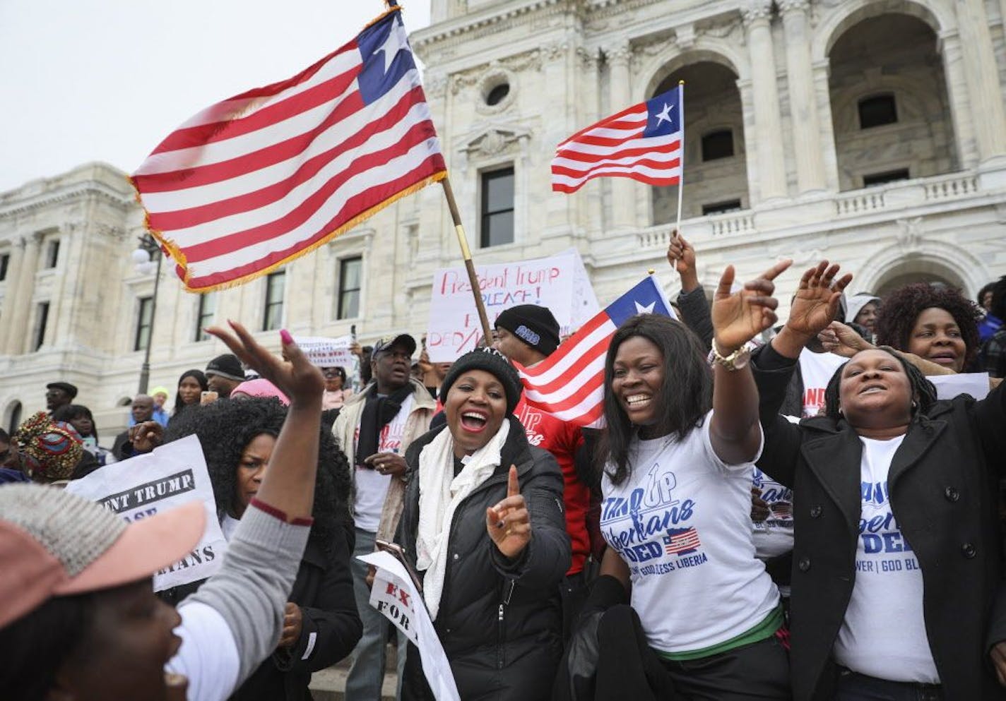 Hundreds of Twin Cities Liberians, including Evely Jarbatt (Center), gathered on the steps of the State Capitol a year ago for a rally in support of extending a federal program for Liberian natives called Deferred Enforced Departure, or DED.