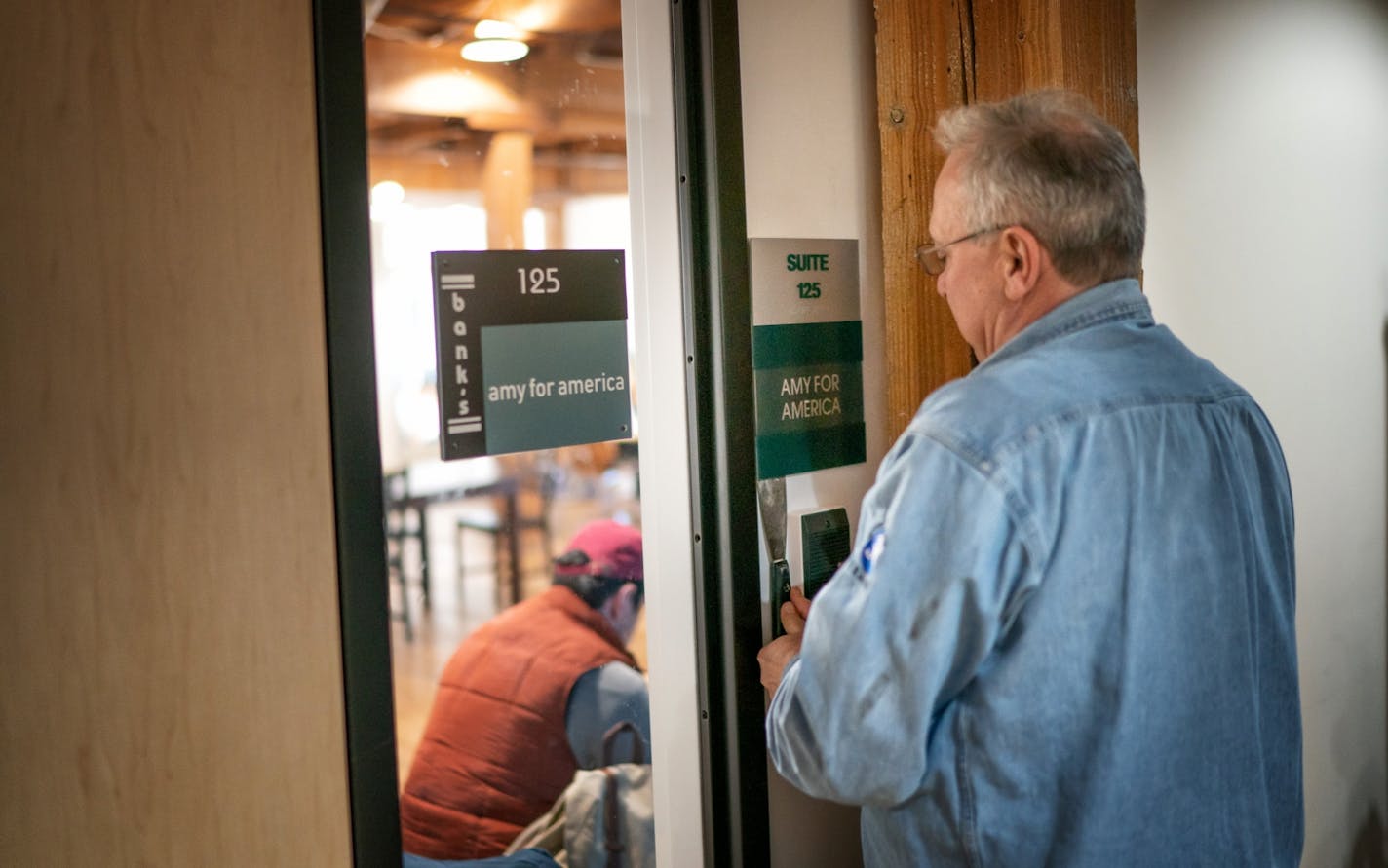 As Klobuchar staffers figured out their next moves inside, a worker from the Minneapolis building where her headquarters has been, removed the Amy For America sign from the door.