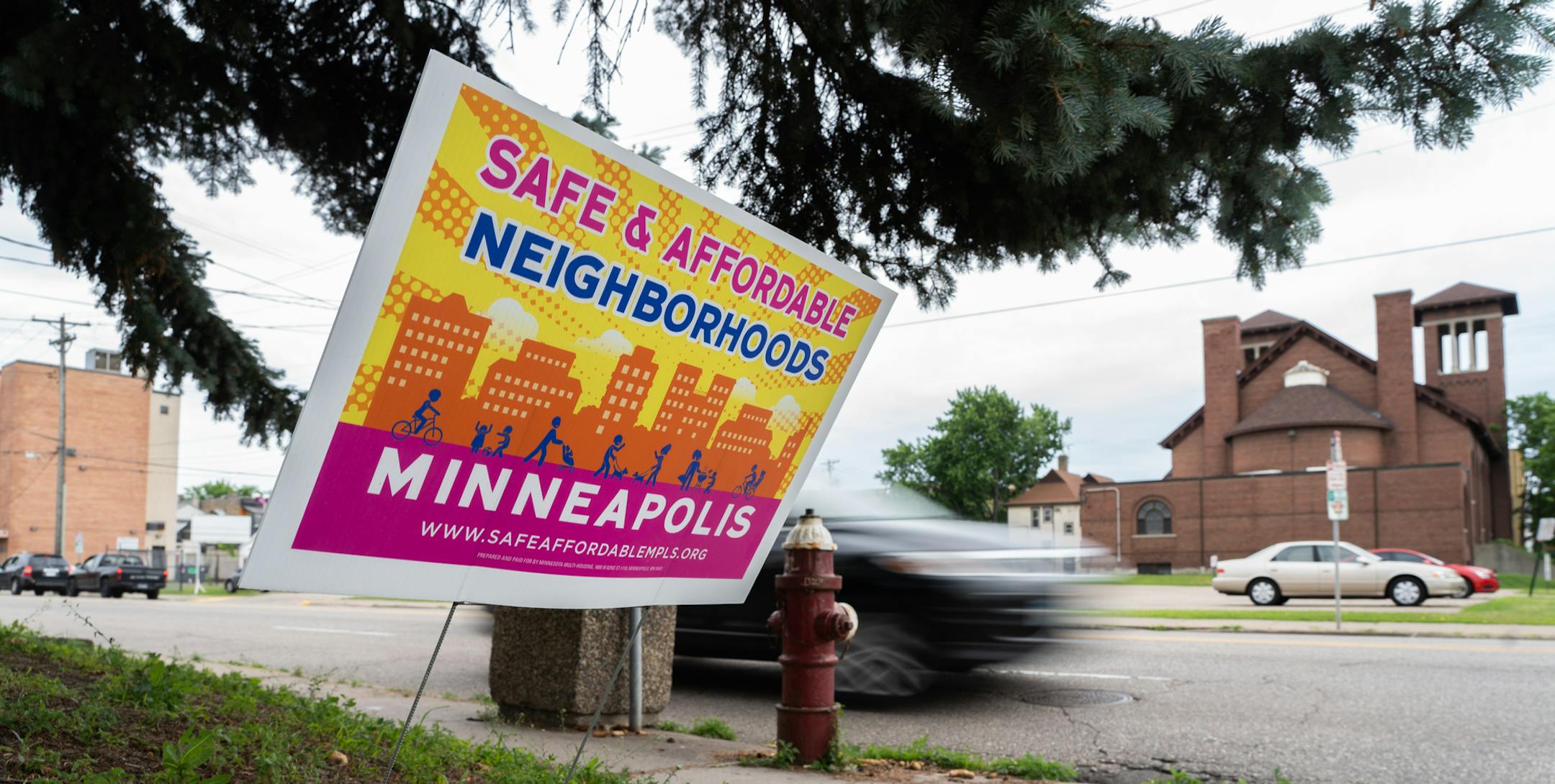 Pink and yellow lawn signs have begun to appear in front of homes and apartment buildings in North East Minneapolis. ] MARK VANCLEAVE &#xa5; The Safe and Affordable Neighborhoods campaign from the the Minnesota Multi Housing Association is fighting a draft city council ordinance that would limit how prospective tenants are screened. Photographed Friday, Jun 21, 2019 in North East Minneapolis.