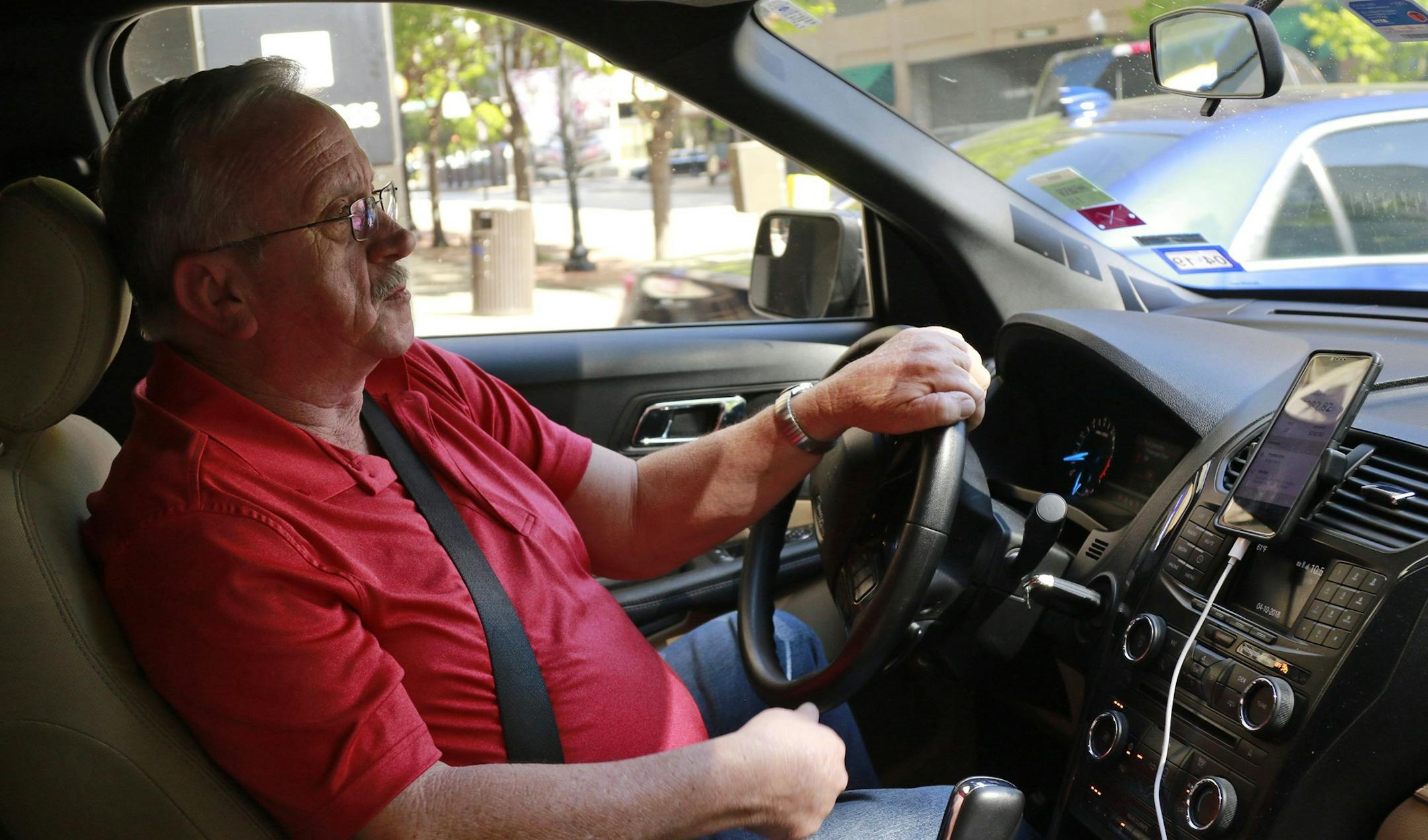 Johnny Pollard, of Haltom City, drives for Uber full time and says the job has saved him from unemployment and provided him with a good living. (Rodger Mallison/Fort Worth Star-Telegram/TNS) ORG XMIT: 1228733