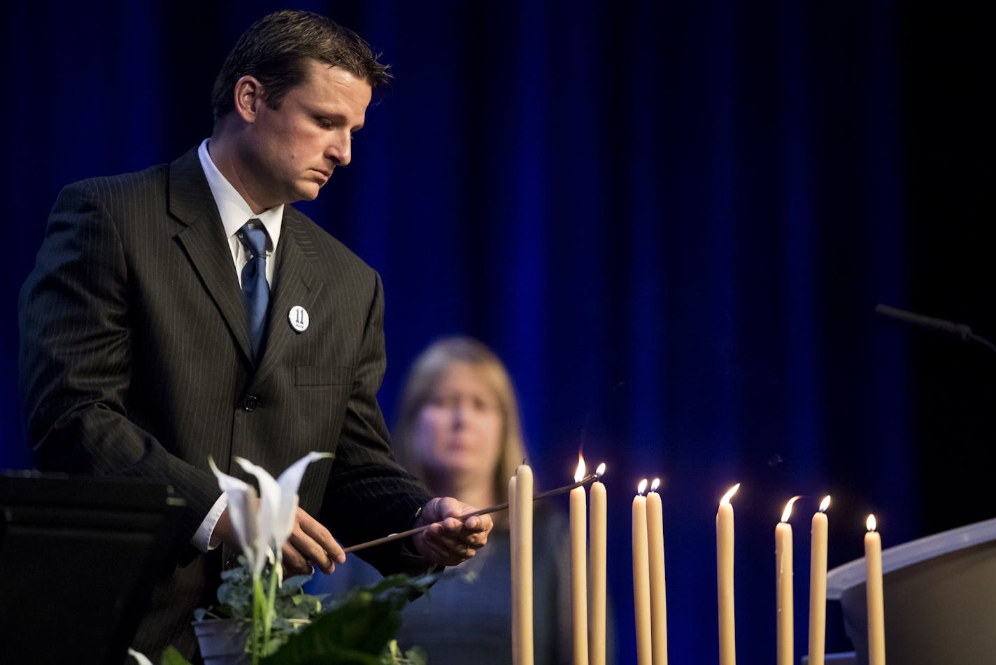 Childhood friend of Jacob Wetterling Aaron Larson, who was witness to his abduction, lit a candle for his friend during a memorial service for Jacob Wetterling at Clemens Field House at the College of Saint Benedict in St. Joseph, Minn., on Sunday, September 25, 2016. ] RENEE JONES SCHNEIDER &#x2022; renee.jones@startribune.com