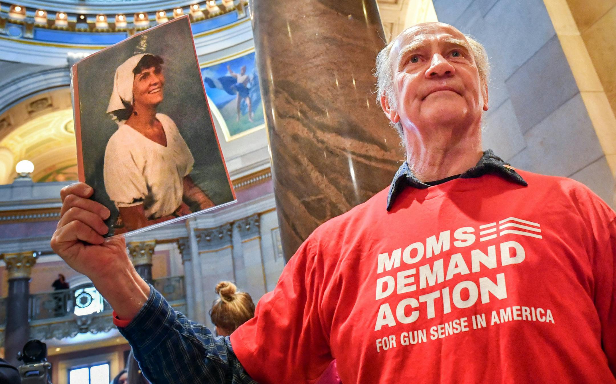 Bob Mokos held a photograph of his murdered sister outside the House Chamber on the first day of session. ] GLEN STUBBE &#x2022; glen.stubbe@startribune.com Tuesday, February 20, 2018 The 2018 legislative session convenes in St. Paul with House and Senate convening at 12 noon. Biggest possible drama is in the Senate, where uncertainty around the status of Lt. Gov. Michelle Fischbach who is trying to simultaneously hold her Senate session.