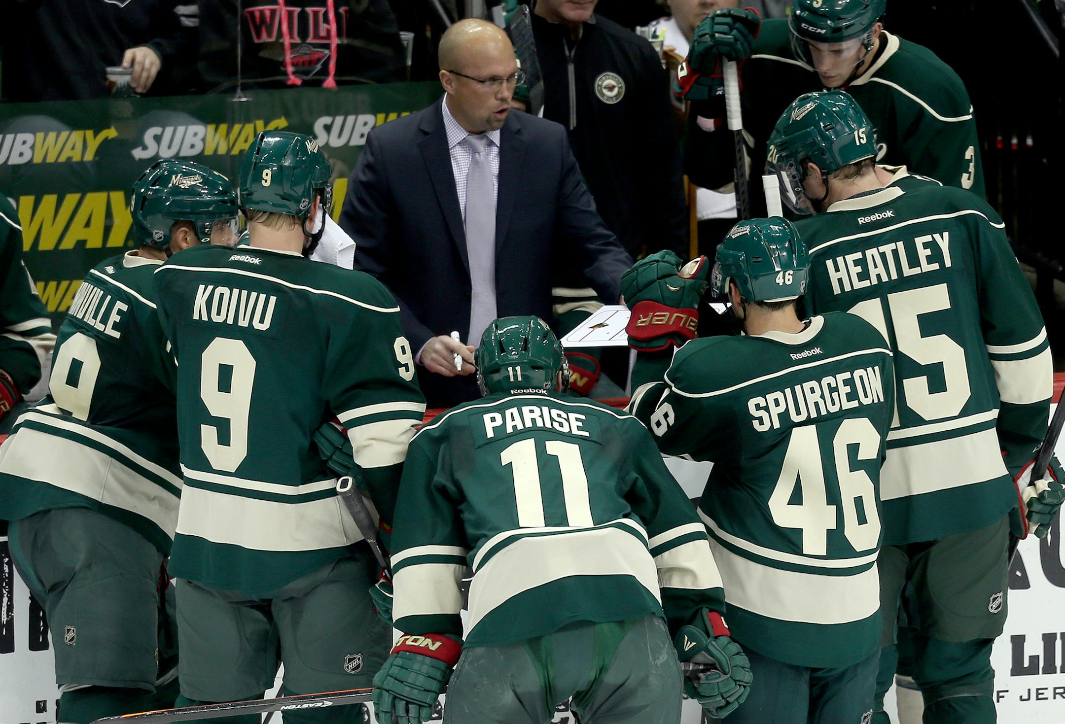 Coach Mike Yeo has a meeting with his players during a time out in the third period at Xcel Energy Center in St. Paul, MN on November 29, 2013. The Colorado Avalanche beat the Minnesota Wild by the score of 3-1. ] JOELKOYAMA‚Ä¢jkoyama@startribune Minnesota Wild vs Colorado Avalanche