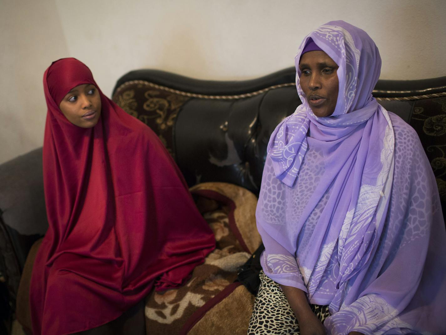 Right to left; Fadumo Hussien, 48, mother of Guled Ali Omar who was arrested and charged with conspiracy to aid and support a terrorist organization, and her daughter Shukri Omar, 23, talked about their brother/son at home in Minneapolis, Minn., on Monday, April 20, 2015. ] RENEE JONES SCHNEIDER &#x2022; reneejones@startribune.com