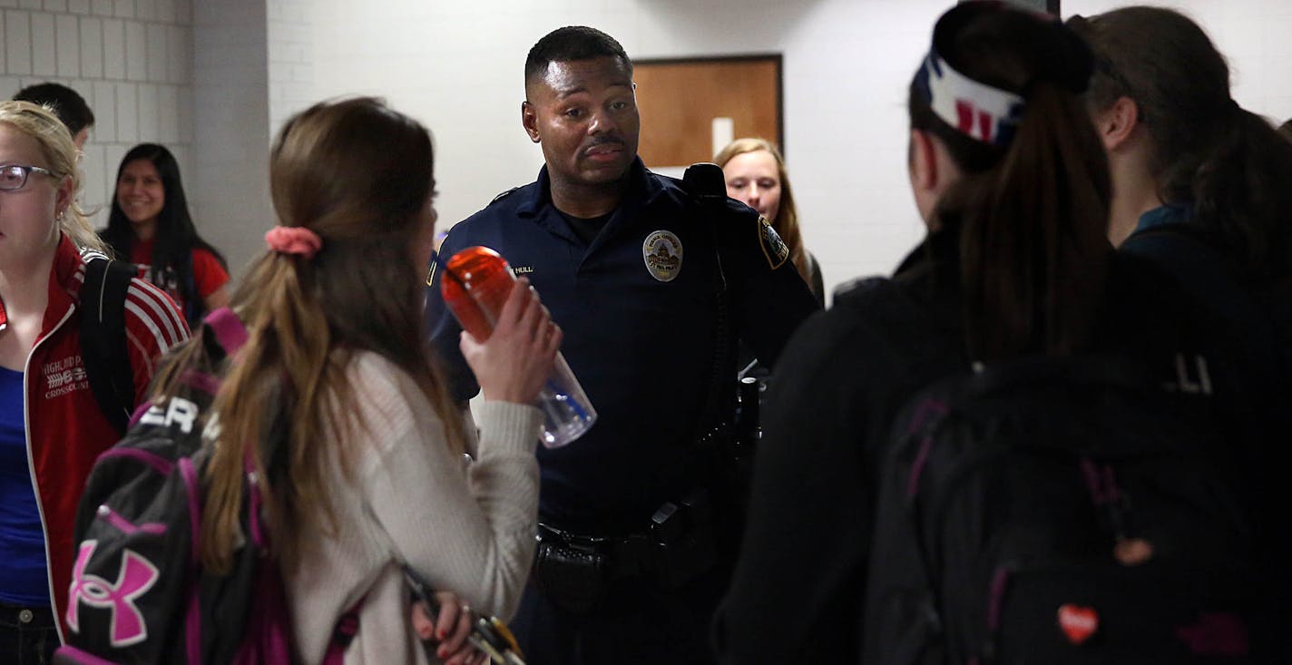 Cortez Hull, school resource officer (SRO) at Highland Park High School in St. Paul, interacted with students at the end of the school the day. ] JIM GEHRZ &#xef; james.gehrz@startribune.com / St. Paul, MN / June 8, 2016 3:00 PM &#xf1; BACKGROUND INFORMATION: Recent events have brought sharp contrasts in how school resource officers -- cops in the schools -- are viewed locally, and their future in two of the state's largest districts is a matter now up for debate. In St. Paul, district leaders h