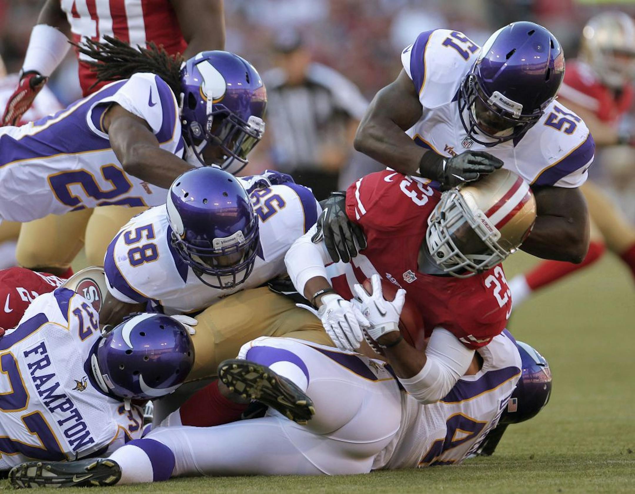 Gang tackling by the Vikings' run defense, like this effort on 49ers running back LaMichael James on Friday, didn't happen often enough in the team's first preseason game.