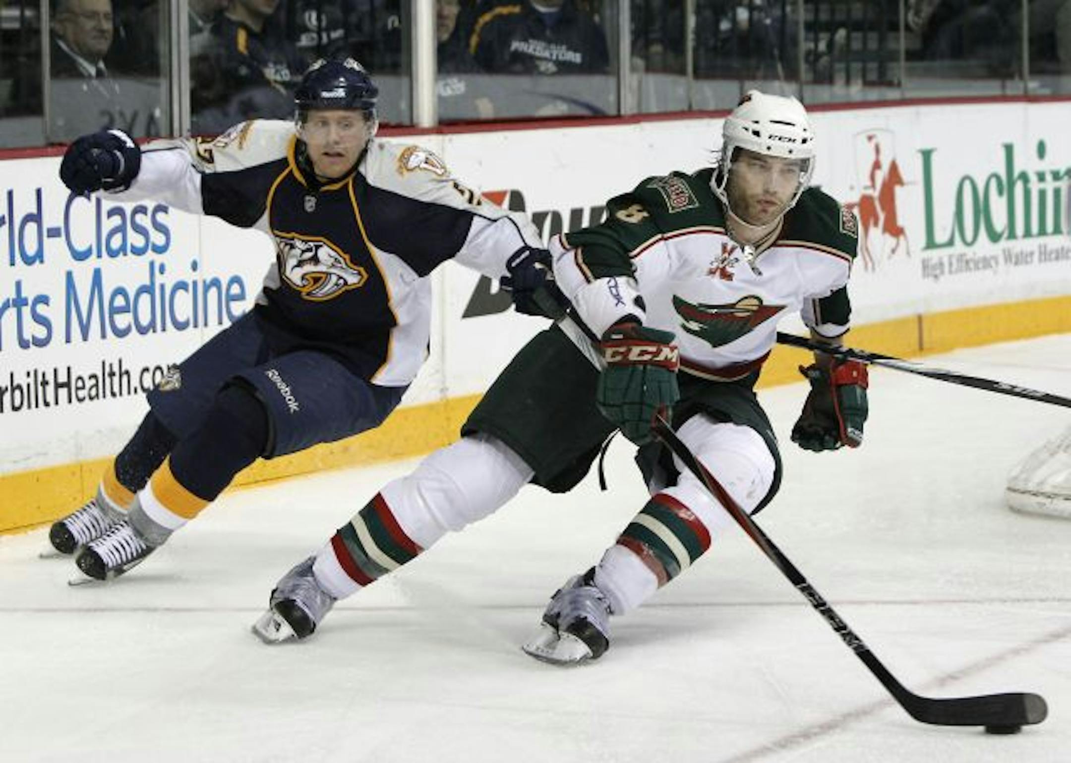 Wild defenseman Brent Burns (right)