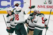 Minnesota Wild players celebrated after a 4-1 win over the Anaheim Ducks in an NHL hockey game in Anaheim, Calif., Wednesday, Dec. 21, 2022. (AP Photo