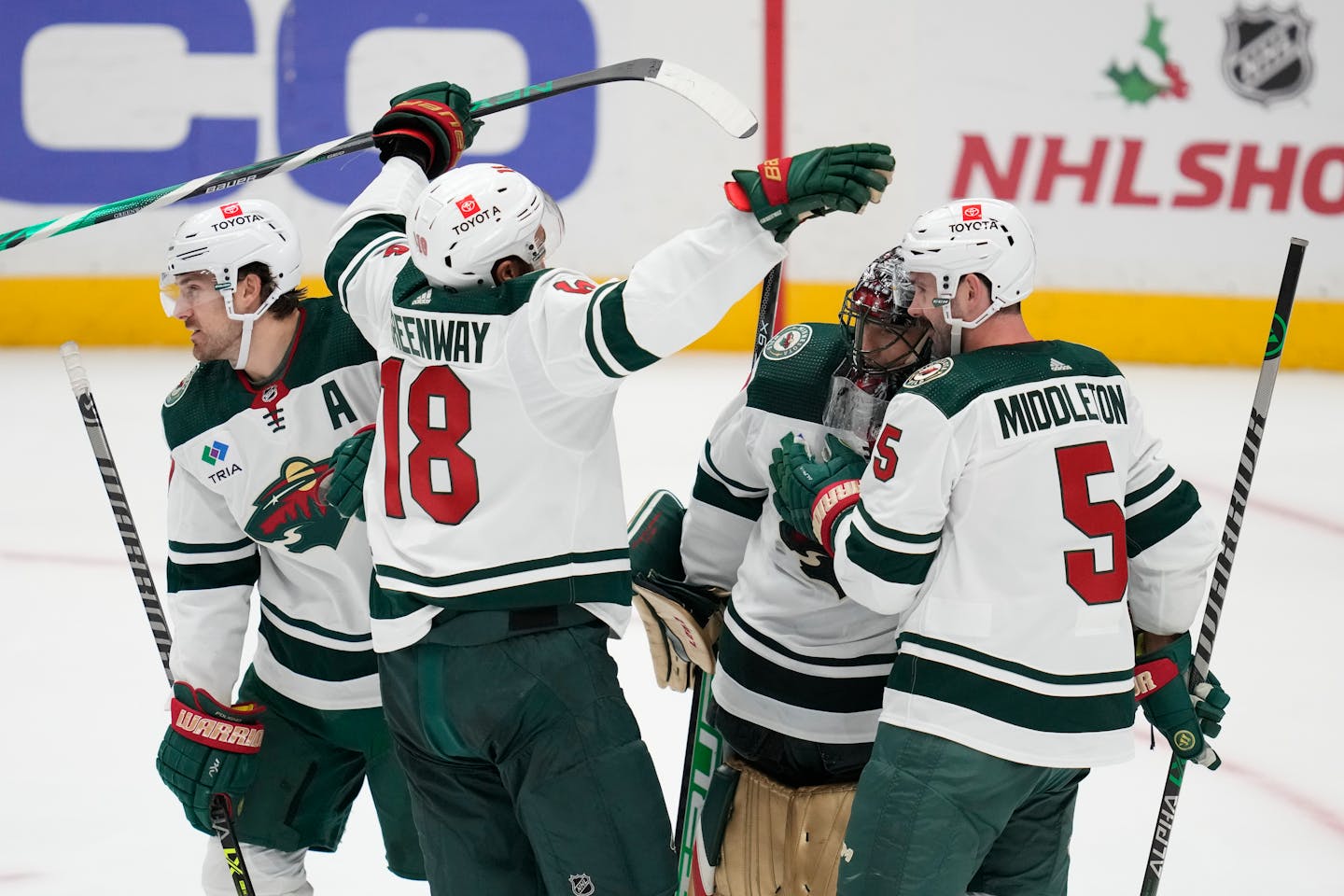 Minnesota Wild players celebrated after a 4-1 win over the Anaheim Ducks in an NHL hockey game in Anaheim, Calif., Wednesday, Dec. 21, 2022. (AP Photo/Ashley Landis)