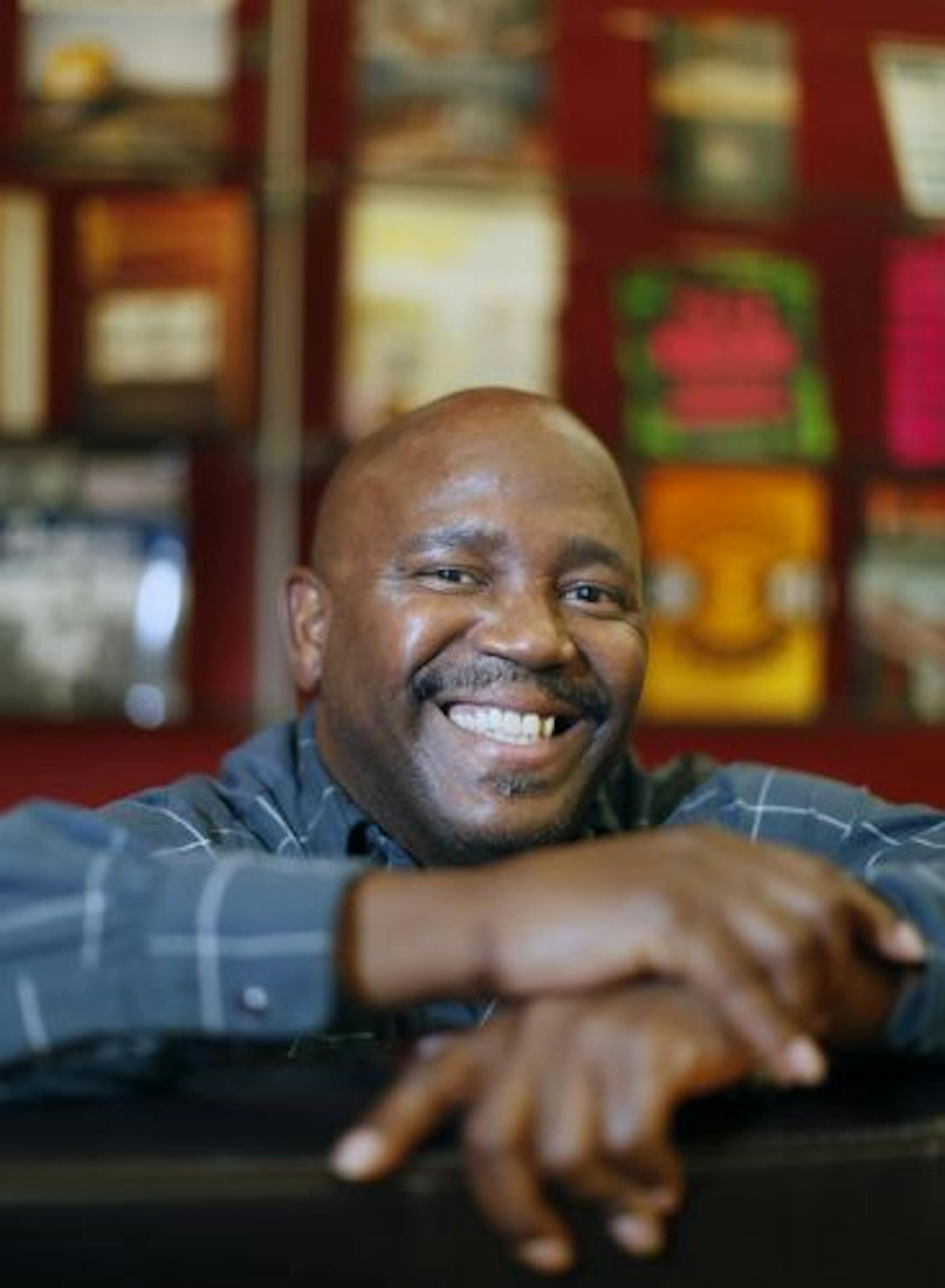 A face behind the numbers: Ken Jackson found his job as an accountant at Quayside Publishing Group through a Minneapolis employment program. He was unemployed for more than a year.