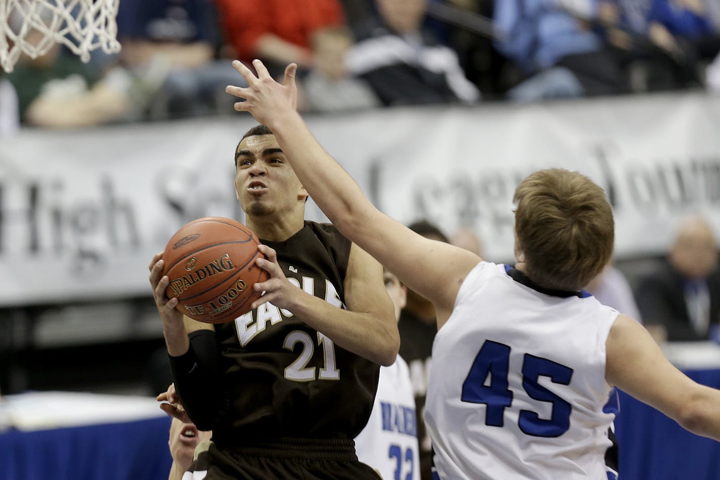 Apple Valley's Tyus Jones went up for two under pressure by Brainerd's Jagar Hanson during the second half of the boys' basketball quarterfinals at the Target Center, Wednesday, March 20, 2013 in Minneapolis, MN. Apple Valley defeated Brainerd 81-67.(ELIZABETH FLORES/STAR TRIBUNE) ELIZABETH FLORES &#x2022; eflores@startribune.com