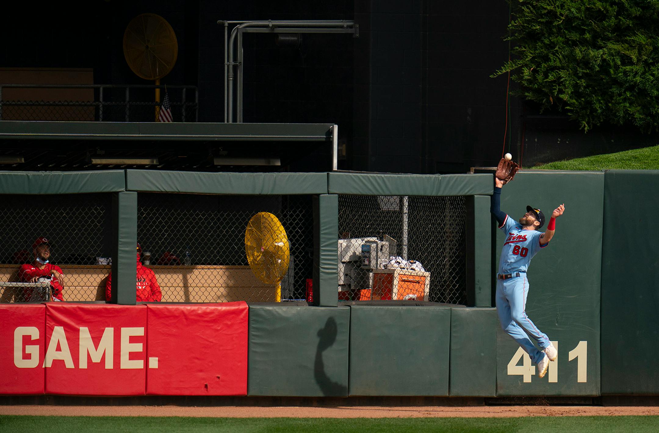 Minnesota Twins center fielder Jake Cave (60) caught a fly ball hit by Cincinnati Reds shortstop Jose Garcia (38) for an out in the third inning.