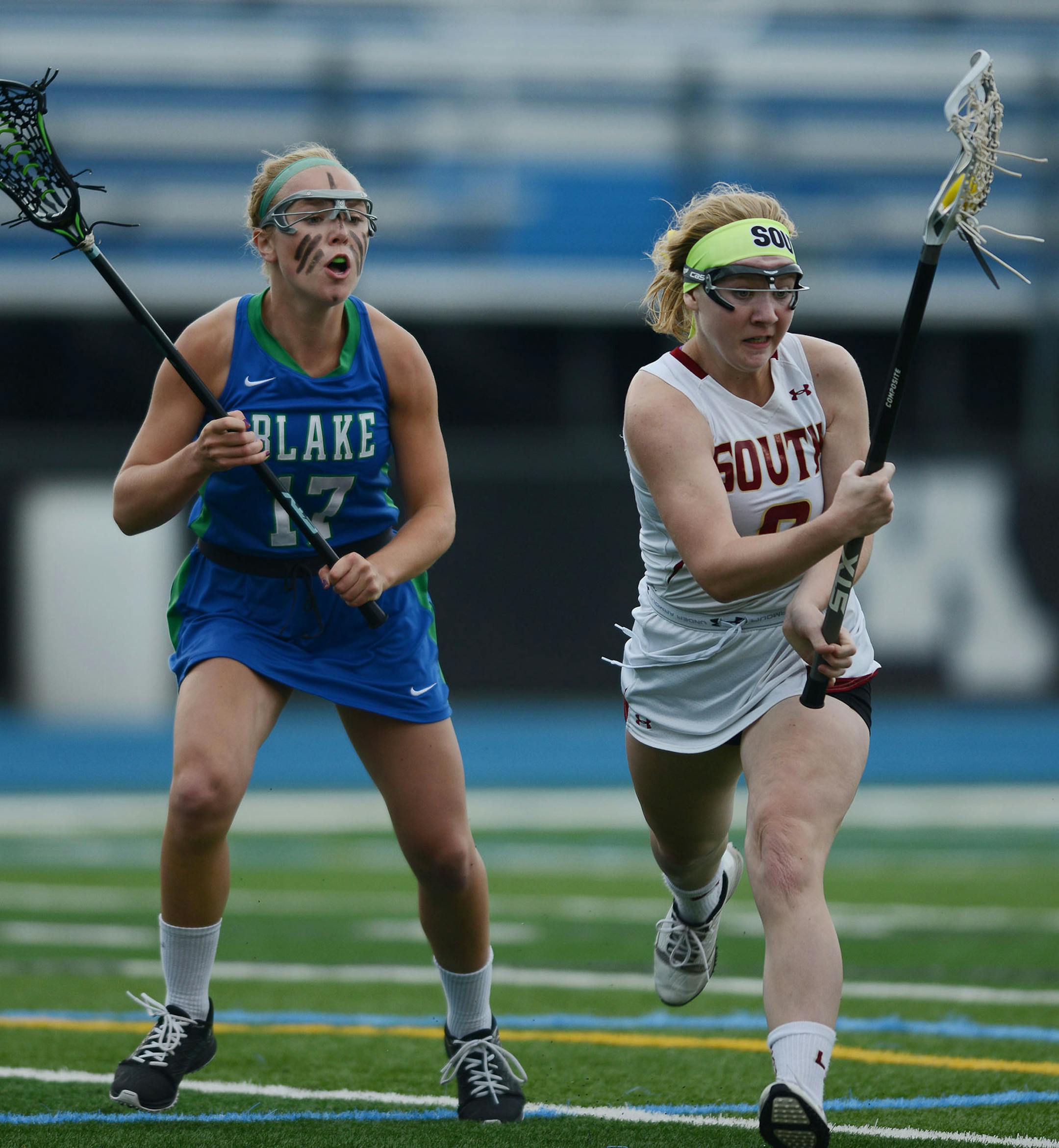 Blake's Sophie Skallerud yells at Lakeville South's Chloe Crosby as she runs with the ball in the 2nd half Thursday evening in Minnetonka. ] RACHEL WOOLF ï rachel.woolf@startribune.com The Blake School met Lakeville South in a girls state lacrosse tournament semifinal game at Minnetonka High School in Minnetonka Thursday evening, June 11, 2015. Lakeville South defeated Blake 11-9.