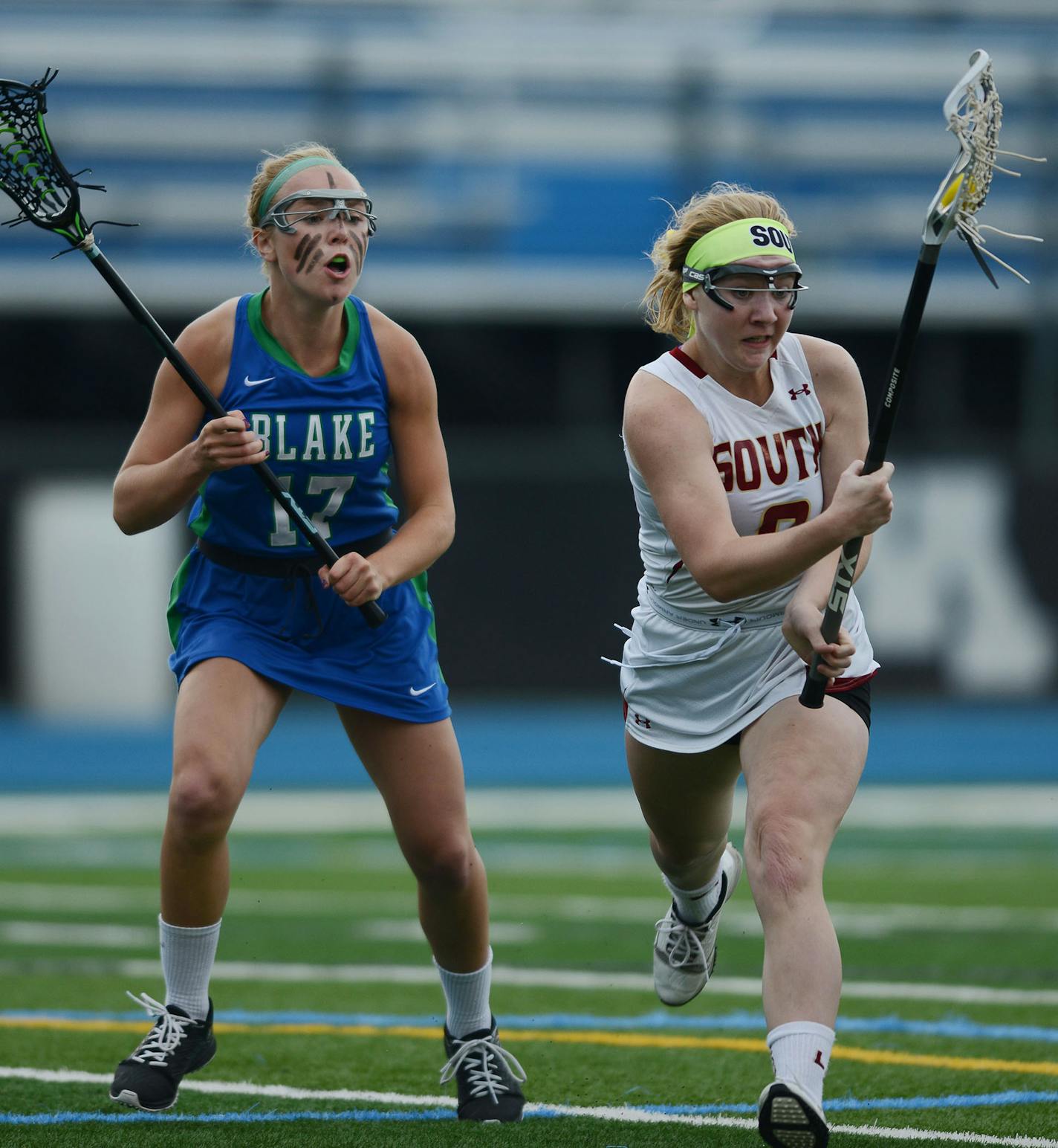 Blake's Sophie Skallerud yells at Lakeville South's Chloe Crosby as she runs with the ball in the 2nd half Thursday evening in Minnetonka. ] RACHEL WOOLF &#xef; rachel.woolf@startribune.com The Blake School met Lakeville South in a girls state lacrosse tournament semifinal game at Minnetonka High School in Minnetonka Thursday evening, June 11, 2015. Lakeville South defeated Blake 11-9.