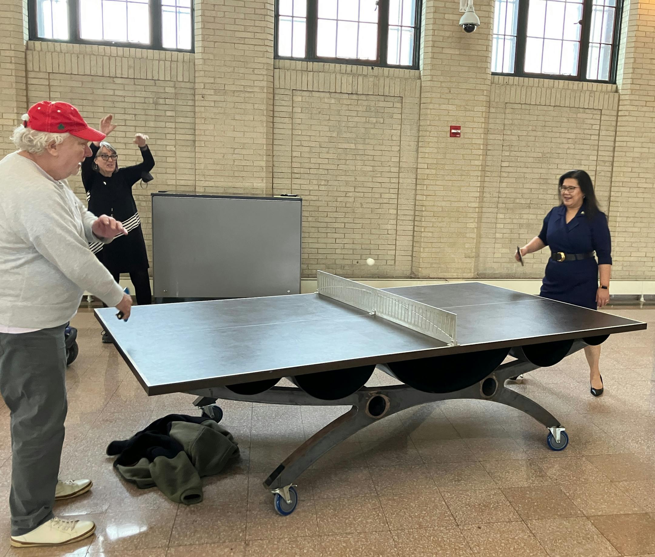 St. Paul Mayor Kaohly Her (right) faces off against skyway-walking-group member Gary Haley as Peg Guilfoyle looks on. The mayor joined the group for their Tuesday morning weekly walk through the St. Paul skyway system on Feb. 17.