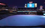 A snow covered Target Field was lit up by the scoreboard during Twinsfest in 2019.