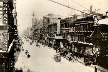 Activity hums on Nicollet Avenue in this winter scene from the 1890s.