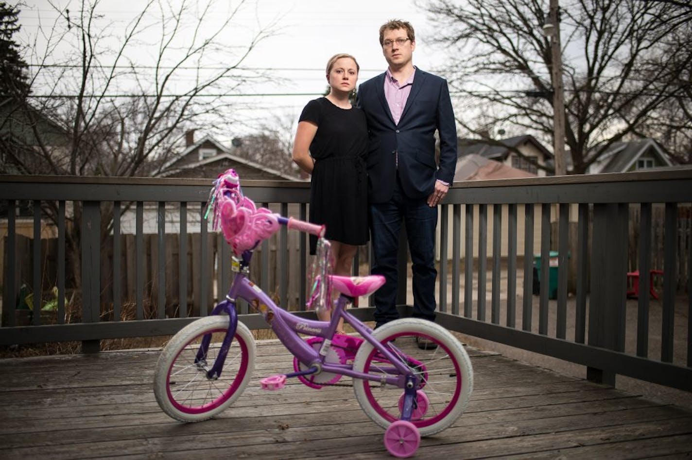 Hannah and David Edwards were photographed behind their home with their 5-year-old daughter's bicycle on Tuesday, April 12, 2016 in St. Paul, Minn.