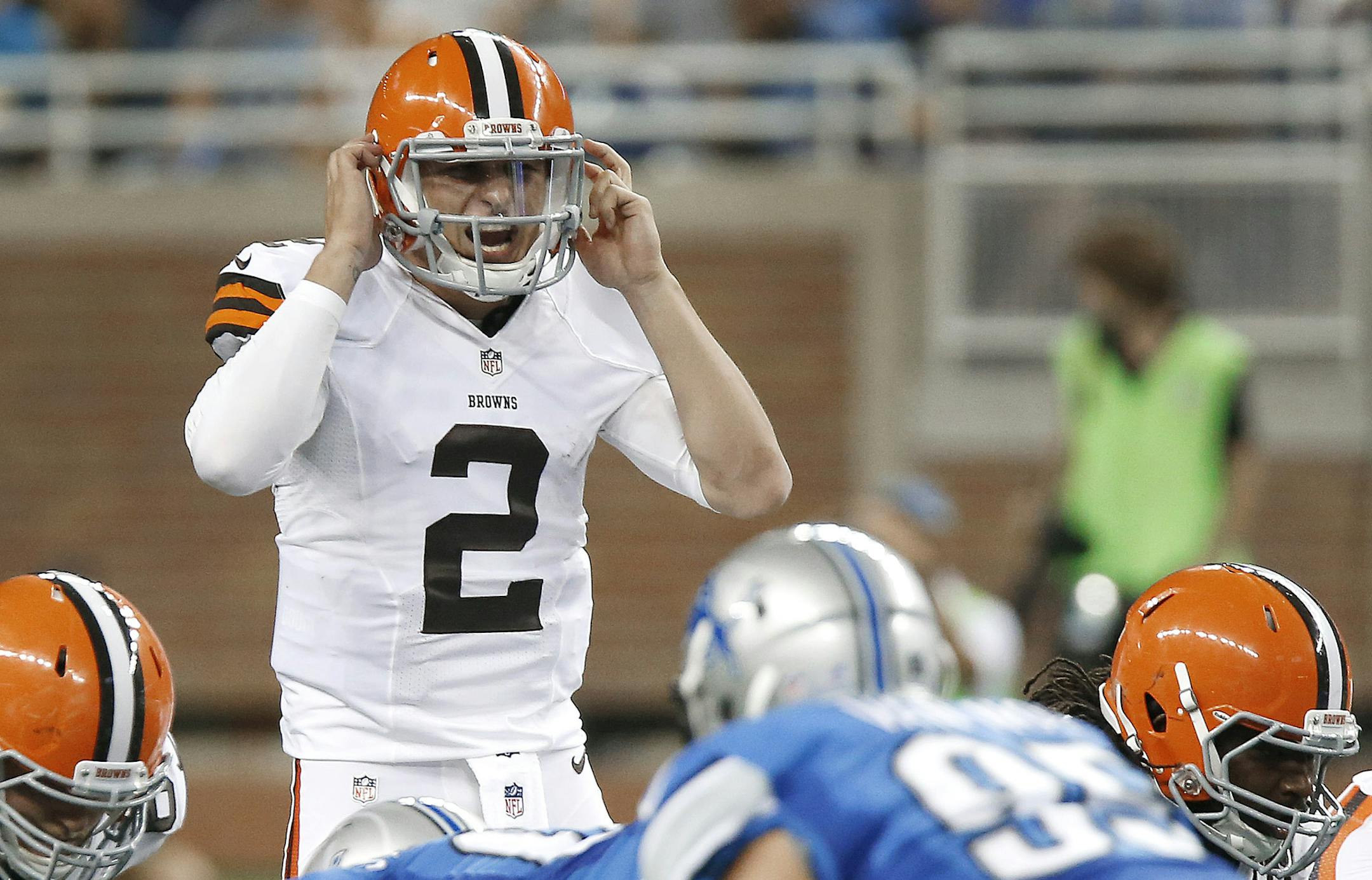 Cleveland Browns quarterback Johnny Manziel (2) audibles against the Detroit Lions in the second half of a preseason NFL football game at Ford Field in Detroit, Saturday, Aug. 9, 2014. (AP Photo/Duane Burleson)