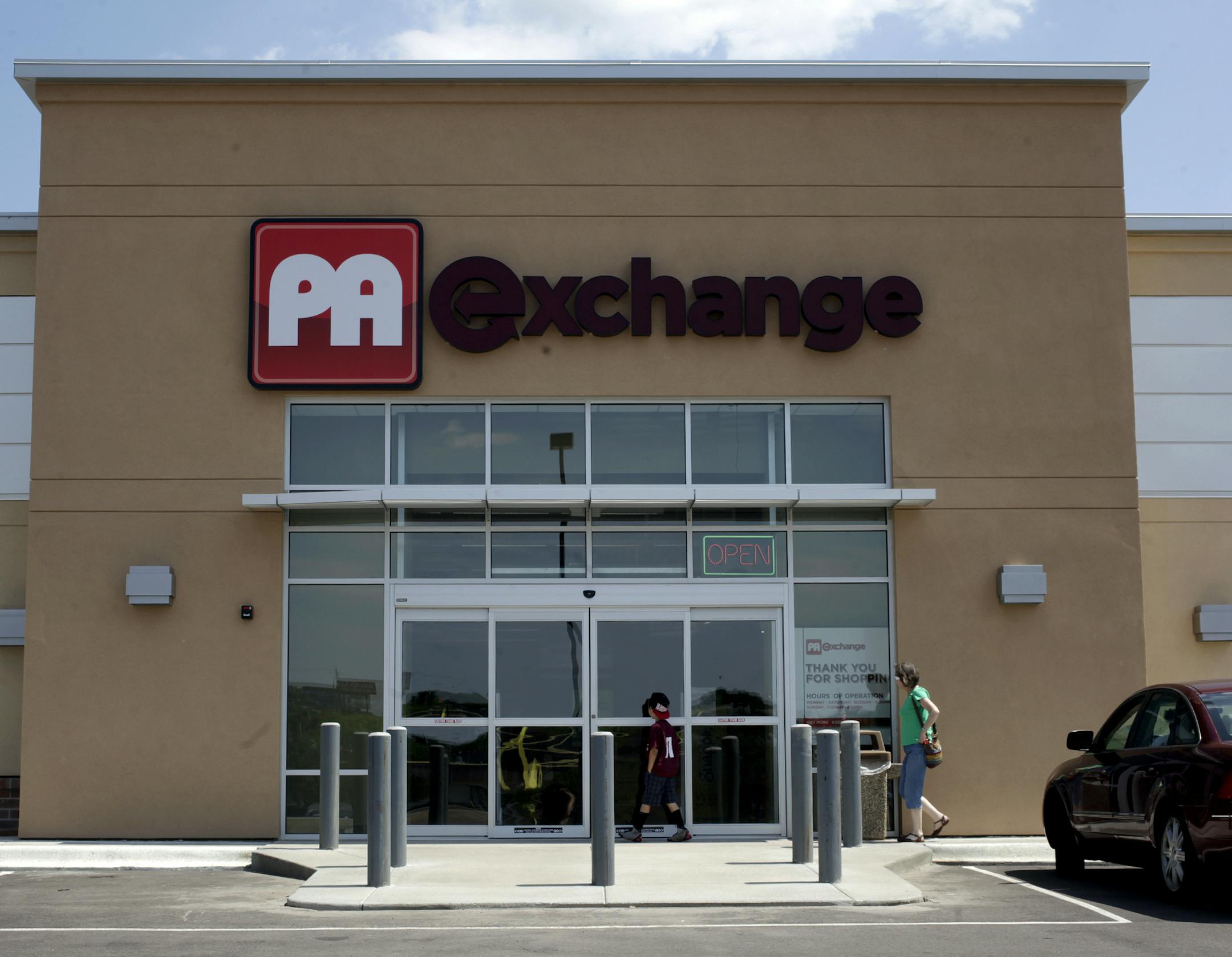 Customers walk into "PA Exchange" in St. Paul, MN on August 1, 2013. ] JOELKOYAMA&#x201a;&#xc4;&#xa2;joel koyama@startribune As Pawn America matures and updates its concept, it has introduced "PA Exchange" stores with the same merchandise as a Pawn America but without the "pawn" part. It's supposed to appeal to shoppers, mostly women, who aren't comfortable in a pawn shop.