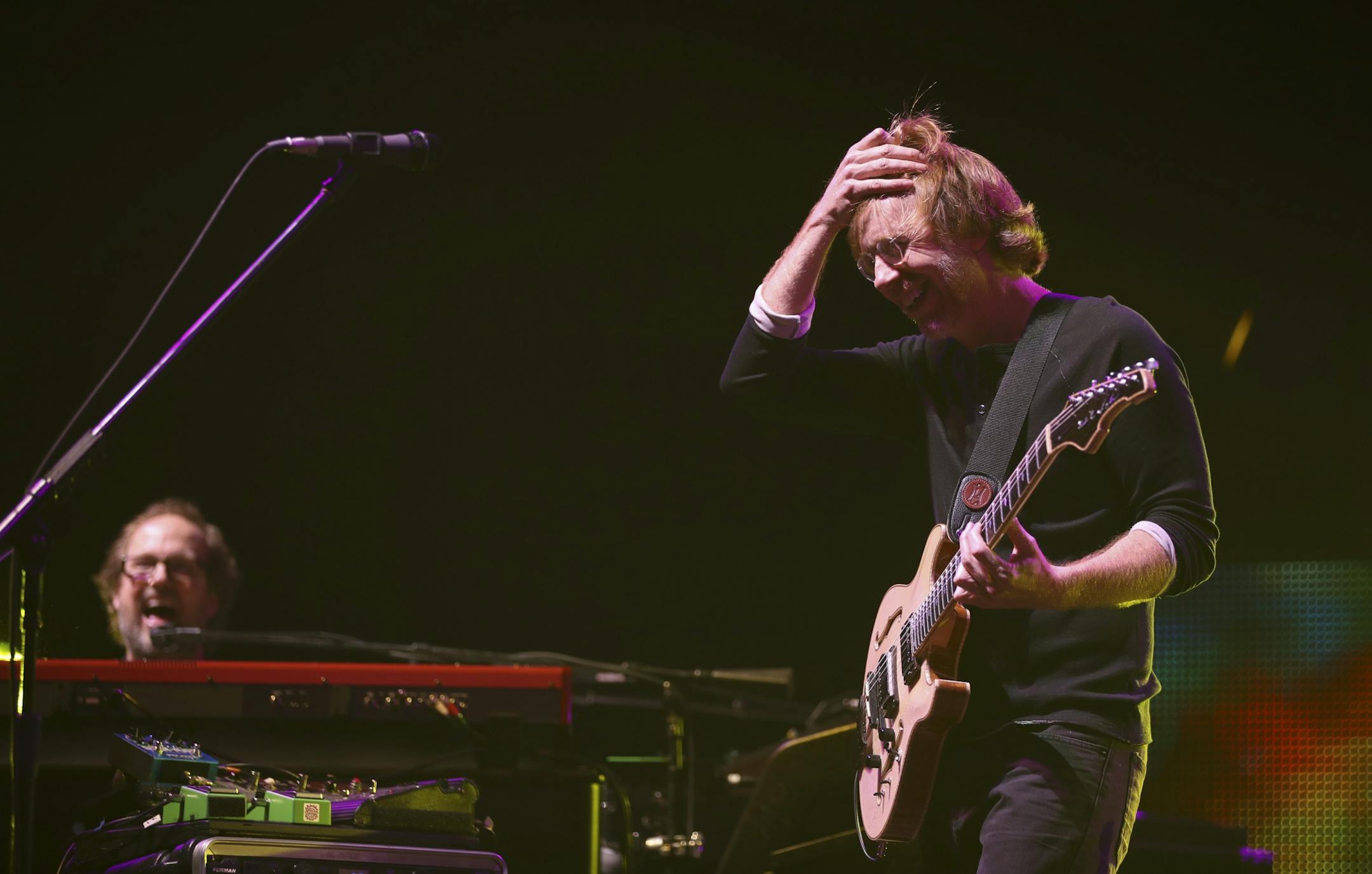 Trey Anastasio, foreground, with keyboardist Page McConnell early in their show Wednesday night.