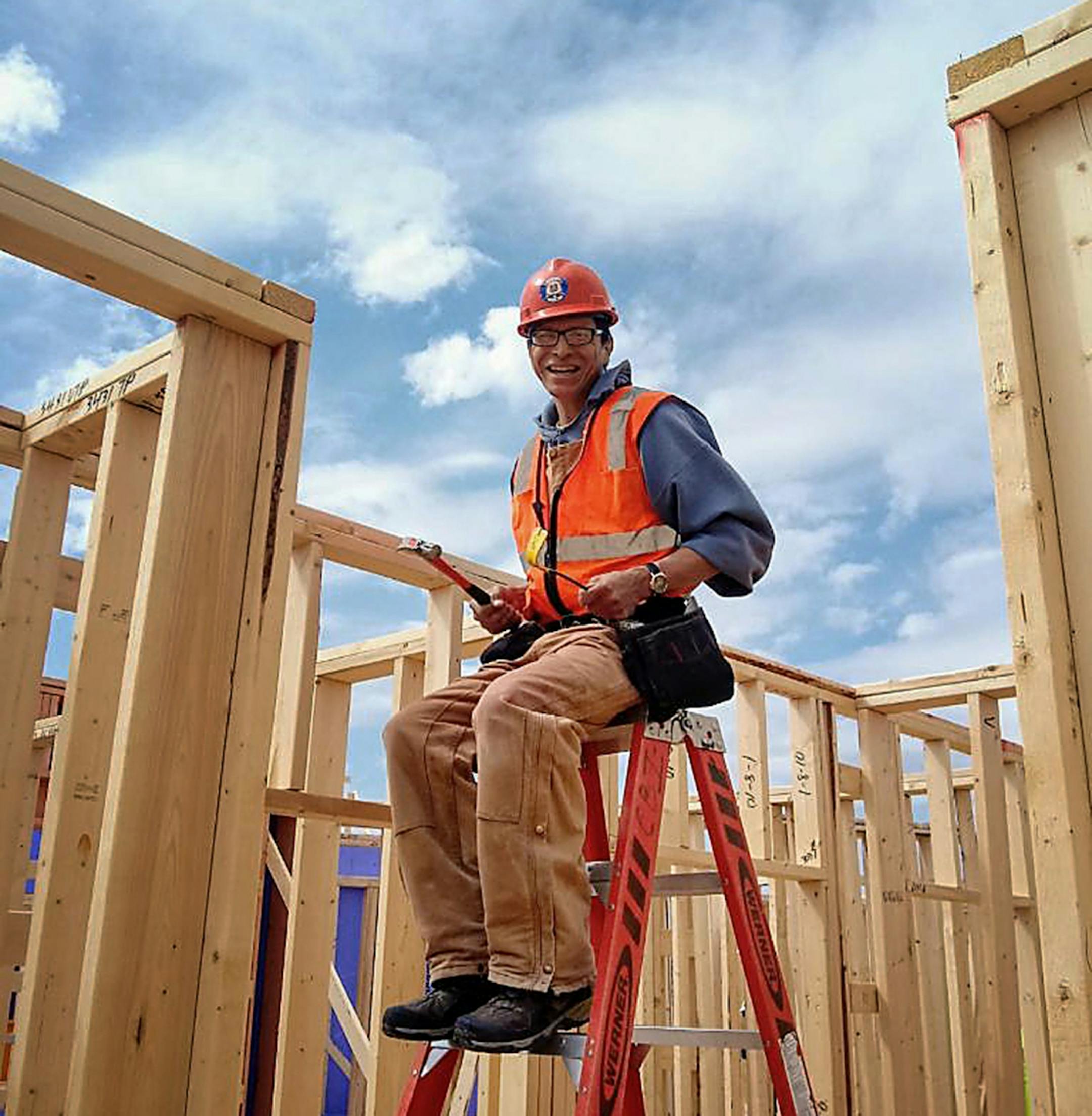Allen Touche, 48, was seen posing for a photo on the construction site of the Red Lake Nation apartment complex that Touche helped build and that he will eventually move into his own apartment in 2021 in this undated handout photo in Minneapolis.