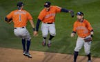 Houston Astros Carlos Correa (1) and George Springer (4) celebrated at the end of the game.