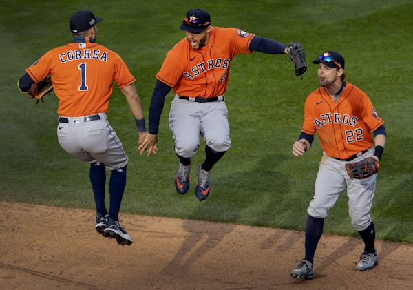 Houston Astros Carlos Correa (1) and George Springer (4) celebrated at the end of the game.