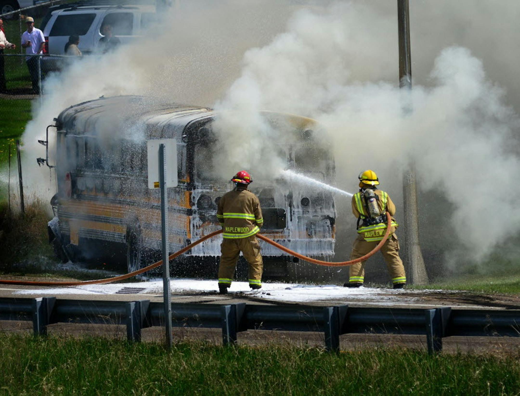 Maplewood firefighters doused a school bus engulfed in flames at the Century Ave. exit ramp on East bound 94, in May 2014.