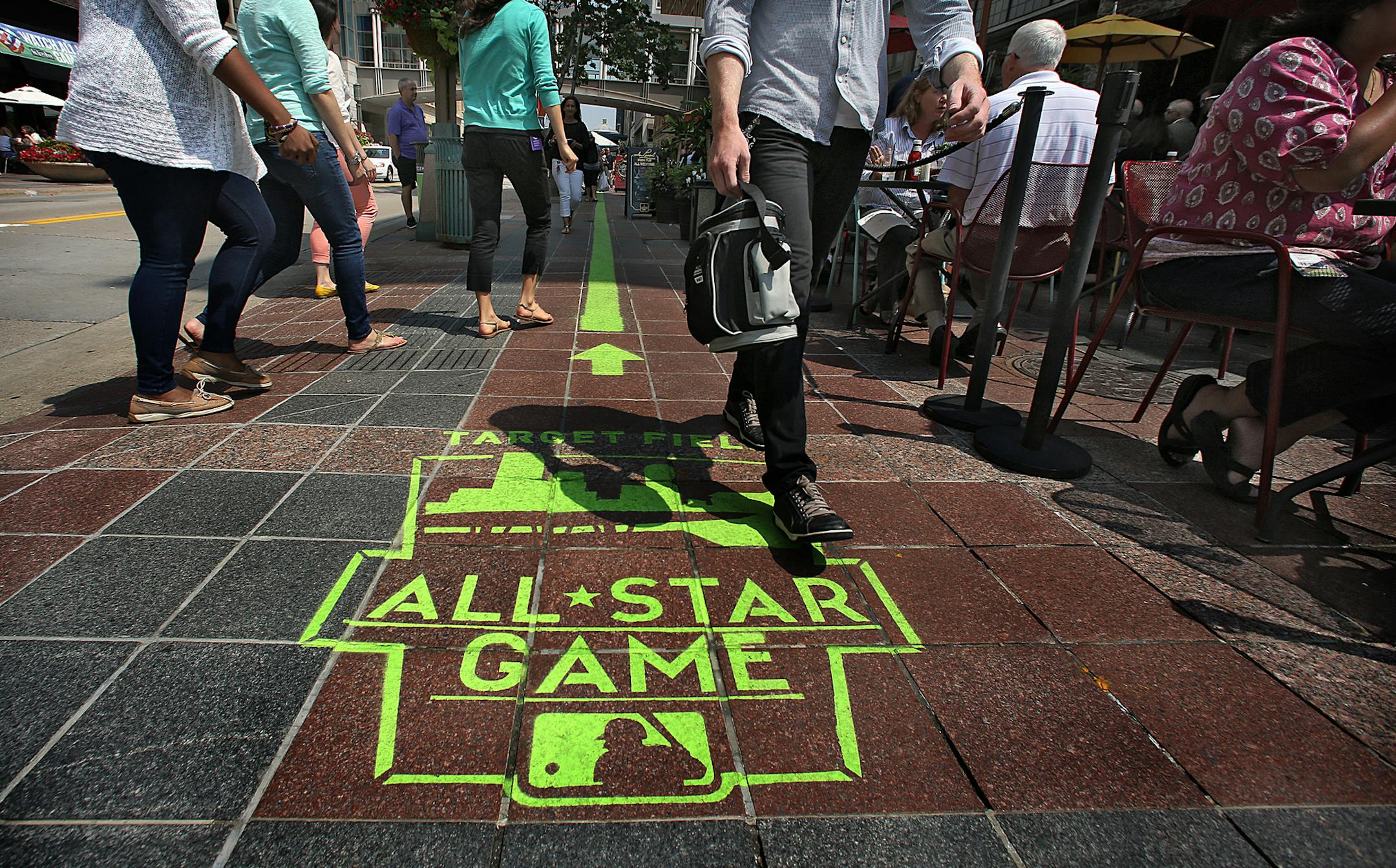 A green painted line with some informational markings runs through a portion of downtown (here along Nicollet Mall) between the Minneapolis Convention Center, site of All-Star FanFest, and Target Field (according to information posted on the MLB web site). ] JIM GEHRZ ‚Ä¢ jgehrz@startribune.com / Shakopee, MN / July 10, 2014 / 1:00 PM