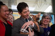 Mayor Jacob Frey held a dog at a news conference at Minneapolis Animal Care and Control in Minneapolis. Nearing capacity, the city is waiving adoption