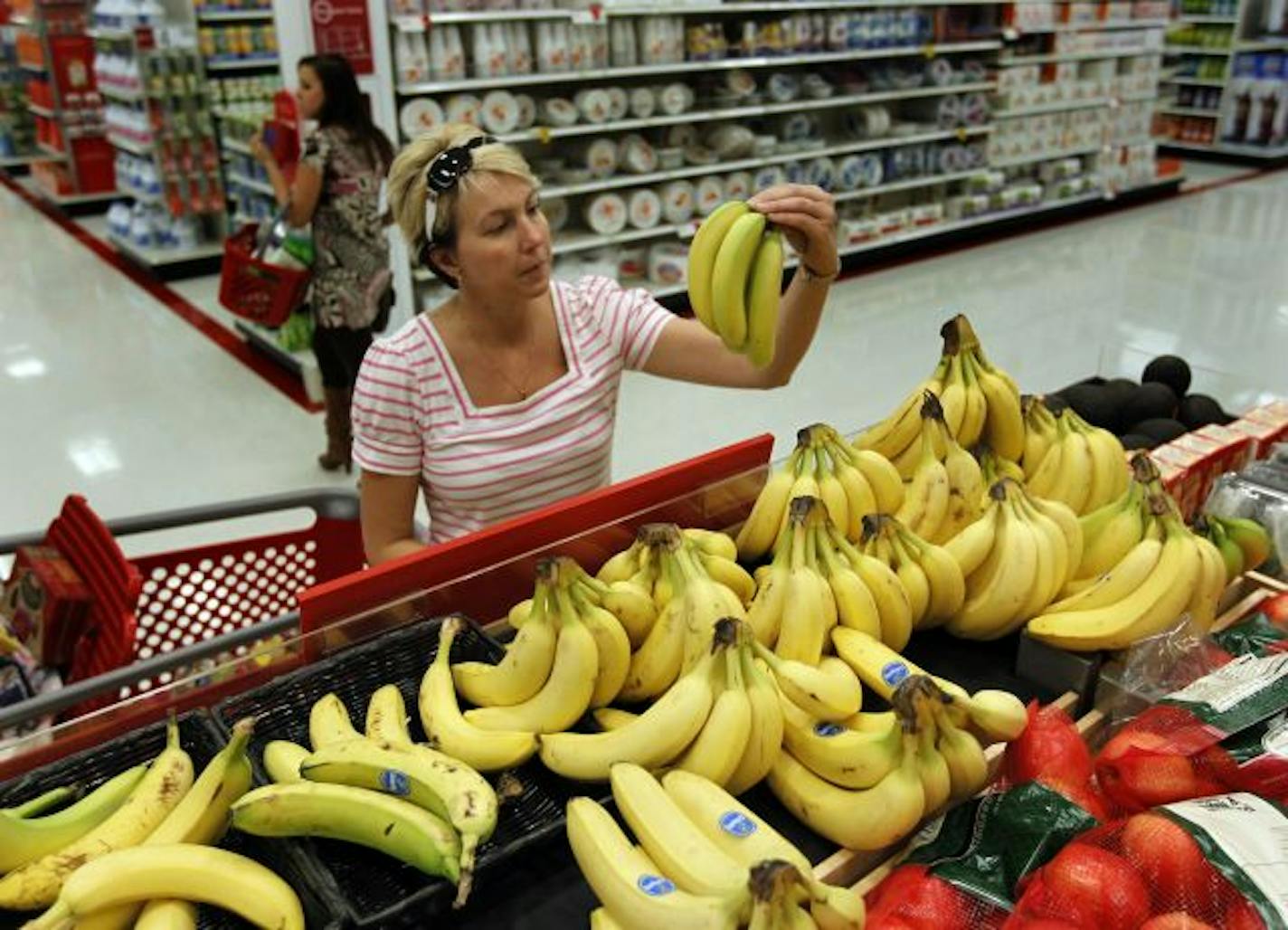 Kiley Black of St. Louis Park shopped at Target Thursday for groceries and a few odds and ends. She is now back to work after being unemployed for four months. Retailers reported surprisingly solid sales gains for September, even though Americans still are dealing with an uncertain economy.