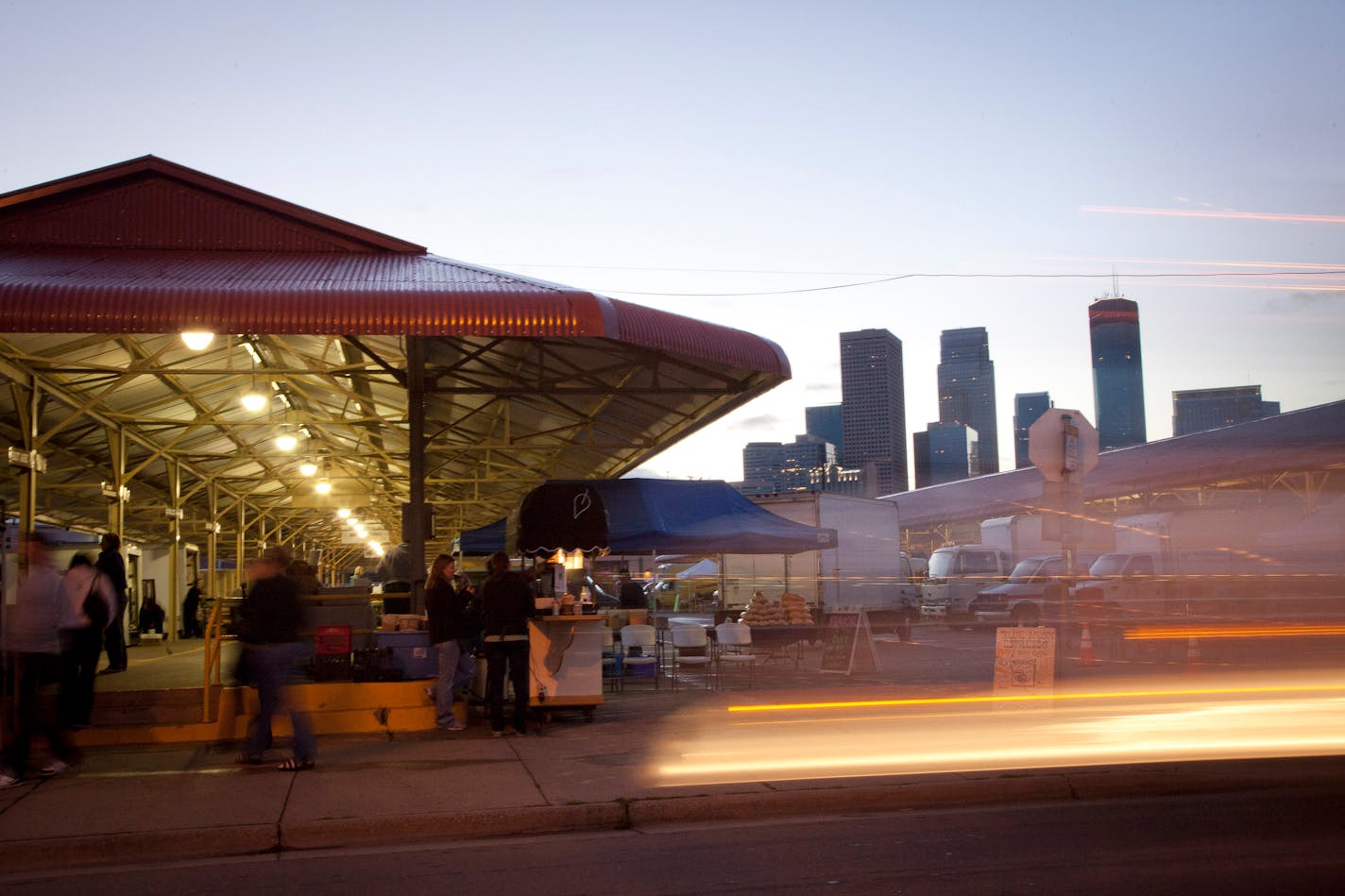 The Minneapolis Farmers Market stands in front of the city skyline of Minneapolis, Minnesota, U.S., on Saturday, Sept. 21, 2013. The House passed a measure last week that would cut $39 billion from nutrition programs over a decade. Under the bill, food-stamp benefits would be stopped next year for an estimated 3.8 million Americans, according to the Congressional Budget Office. Photographer: Ariana Lindquist/Bloomberg