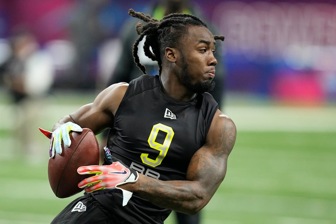 Georgia running back James Cook runs a drill during the NFL football scouting combine, Friday, March 4, 2022, in Indianapolis. (AP Photo/Darron Cummings)