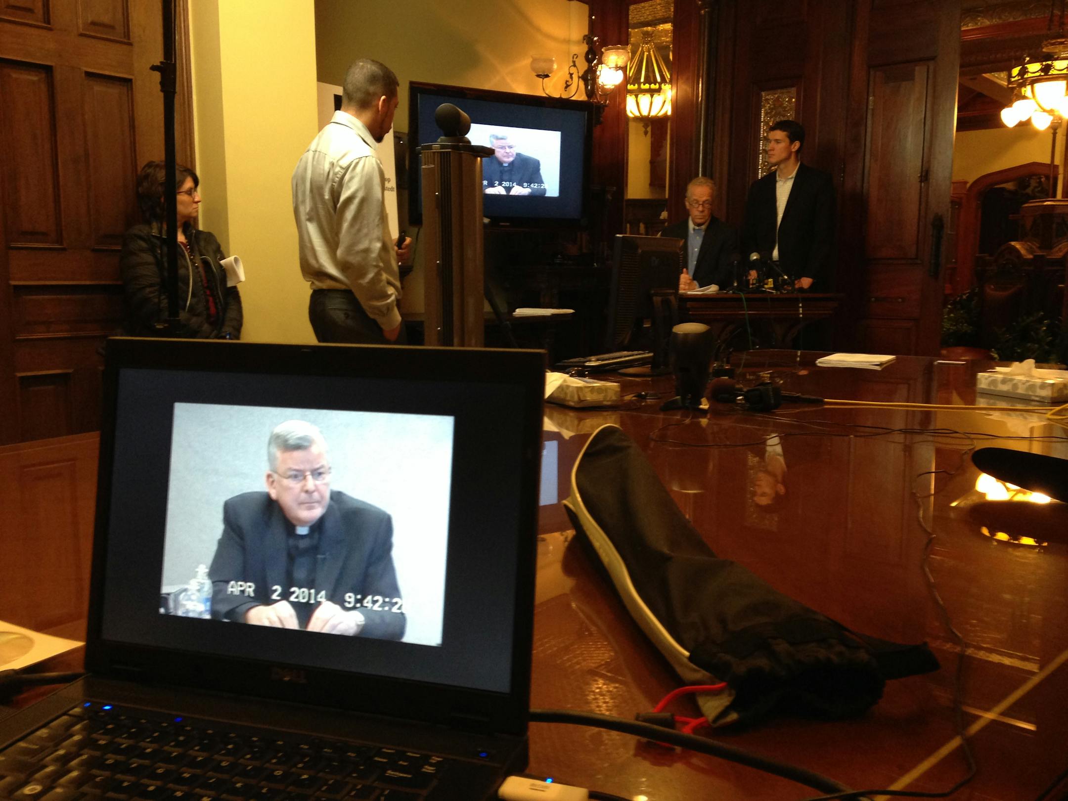 Attorneys Jeff Anderson and Mike Finnegan, far right, showed clips of a deposition with Archbishop John Nienstedt to members of the media Tuesday morning.
