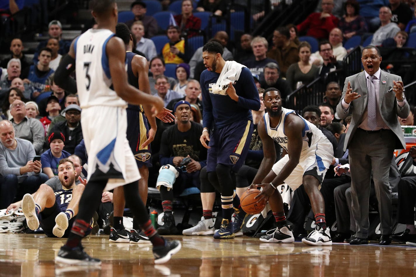 New Orleans Pelicans forward Donatas Motiejunas (12) reacts on the floor after he was fouled by Minnesota Timberwolves guard Lance Stephenson (7) during the second half.