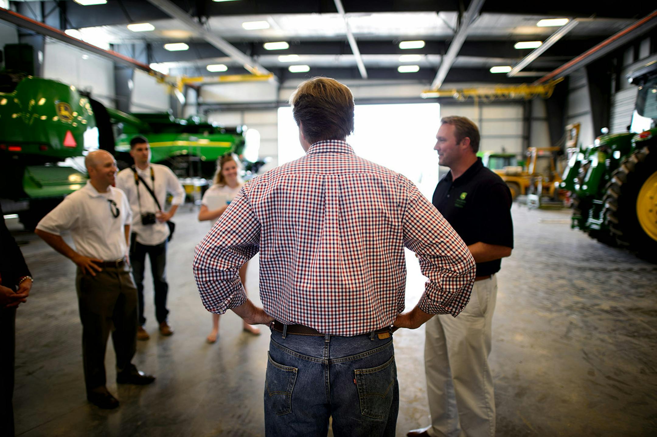 GOP Senate candidate Mike McFadden spoke to Owatonna-area business leaders at Ag Power Enterprises, a John Deere dealer, Wednesday, July 16, 2014. On the right is sales manager Mike Milstead. ] GLEN STUBBE * gstubbe@startribune.com