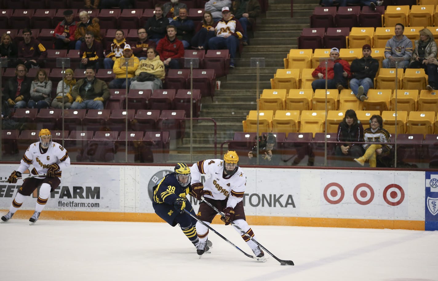 Gophers defenseman Steve Johnson (4) stickhandled away from the defense of Wolverines forward Dexter Dancs (39) before scoring in the third period. ] JEFF WHEELER &#xef; jeff.wheeler@startribune.com The University of Minnesota men's hockey team lost 6-2 to the University of Michigan Thursday night, February 25, 2016 at Mariucci Arena in Minneapolis.