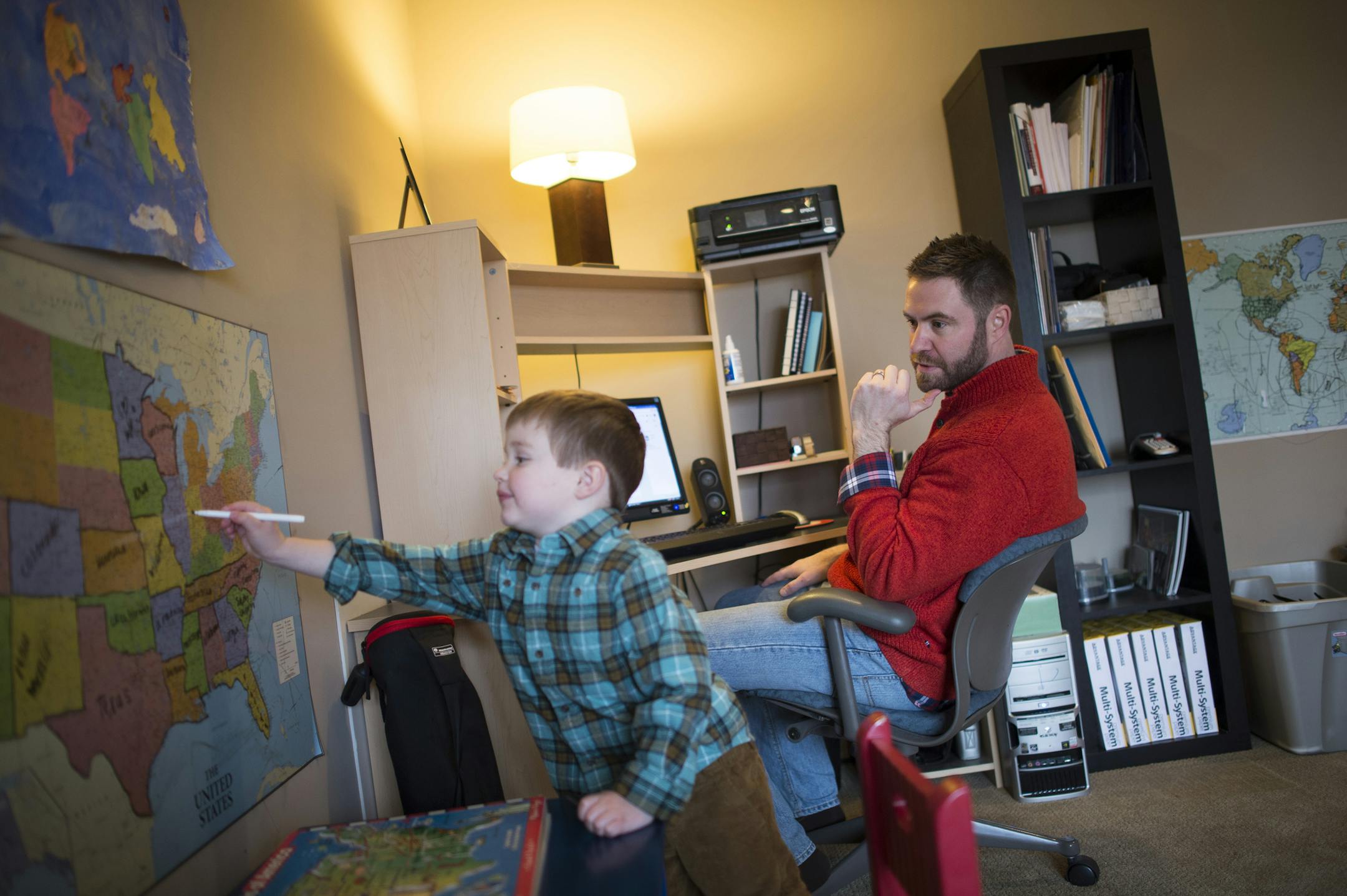 John Drevlow watched as his 3-year-old son, Eli, pointed to places he’s visited on a map in John’s home office.