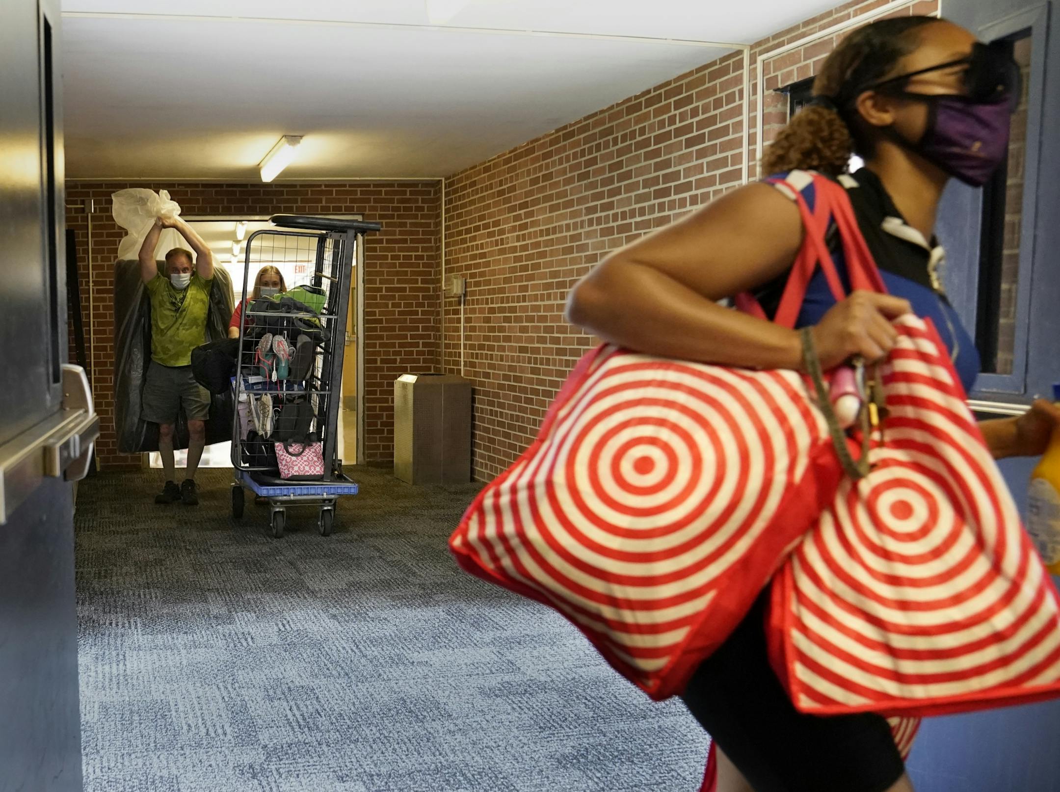 Students began moving into dormitories at Minnesota State University-Mankato Thursday where parents Ryan, left to right, and Karen Ellenbecker moved the belongings of their daughter --freshman Marissa Ellenbecker of Edgar, WI, not pictured, into her Crawford Residence at Minnesota State.