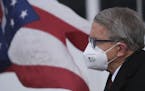 Ohio Gov. Mike DeWine looks on during a press conference Wednesday, Nov. 18, at Toledo Express Airport in Swanton, Ohio. On Tuesday DeWine announced a