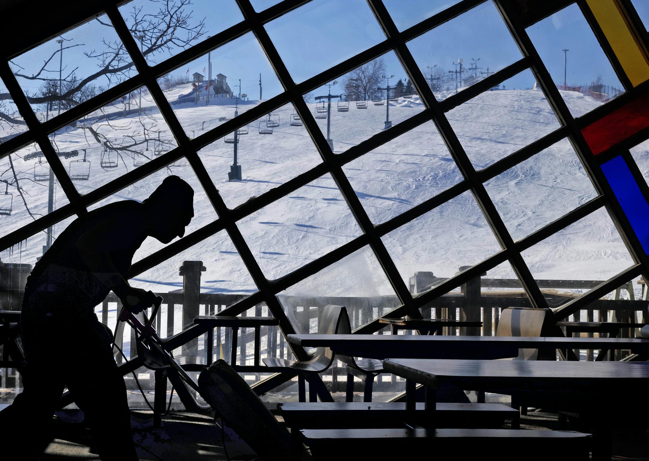 At Buck Hill ski resort in Burnsville, maintenance worker Brian Stoltz was cleaning up the cafeteria in the chalet while the slopes themselves were closed because of the cold temperatures. Stoltz works seven days a week during ski season, and today was no different .]rtsong-taatarii@startribune.com ORG XMIT: MIN1401271421353155