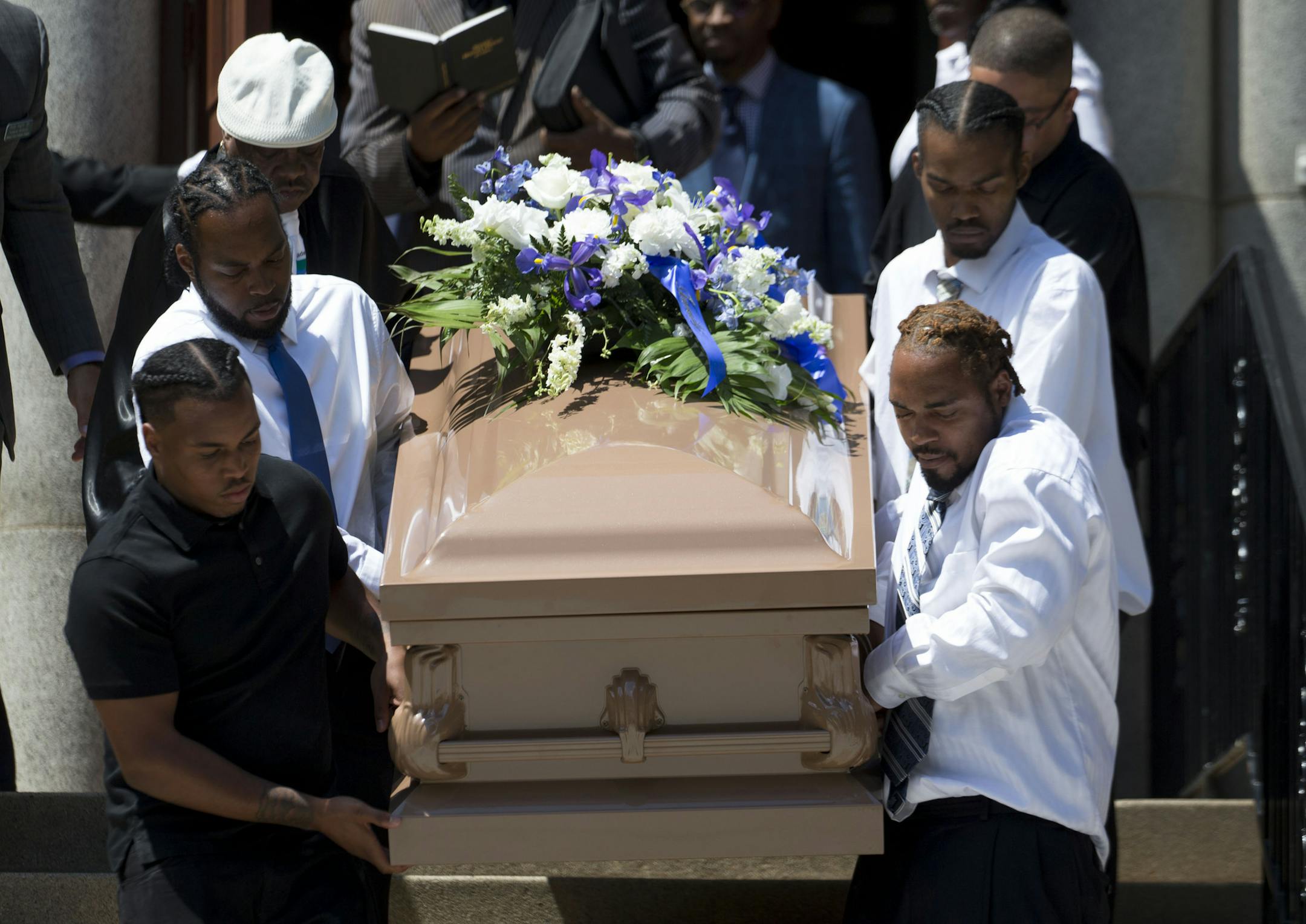 Pallbearers carried the casket holding Blevins down the steps of the church and to the hearse. ] ALEX KORMANN • alex.kormann@startribune.com The funeral for Thurman Blevins, 31, a black man shot and killed by Minneapolis Police on June 23rd, was held at Faith Deliverance Holiness Church on Saturday, July 14, 2018. Hundreds of mourners gathered in the church to pray and chant in Blevins' memory. The service was two hours long after which the casket was brought to Crystal Lake Cemetery.