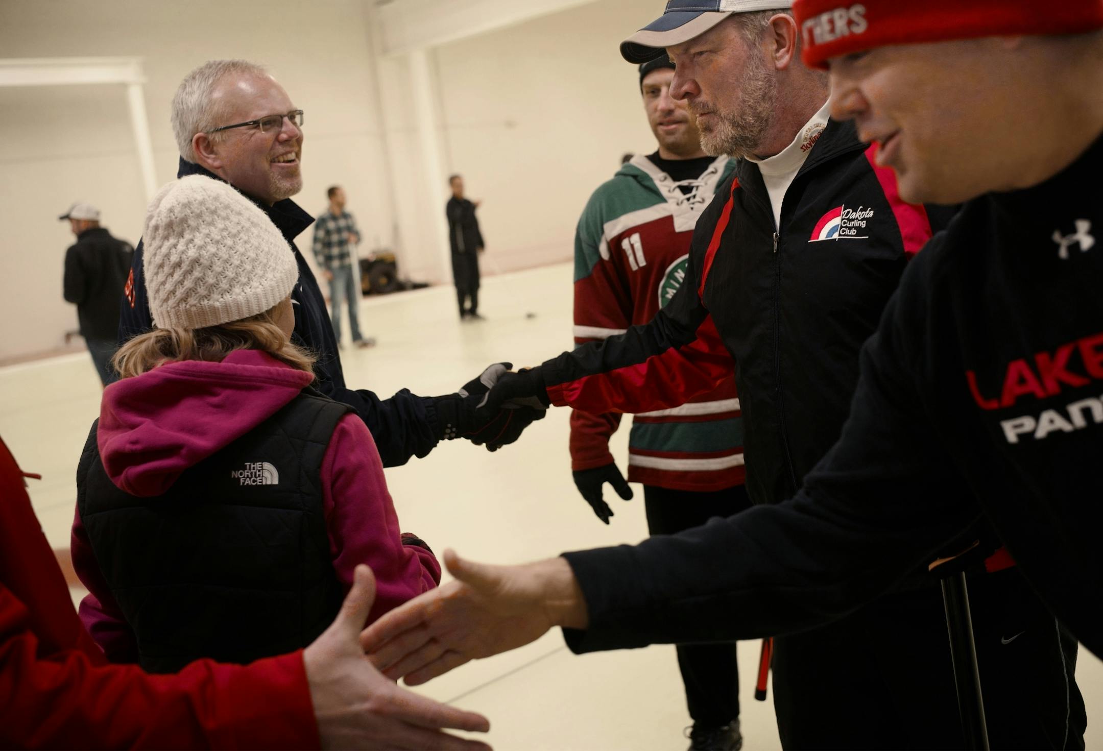 A handshake shows good sportsmanship at the end of the night.
