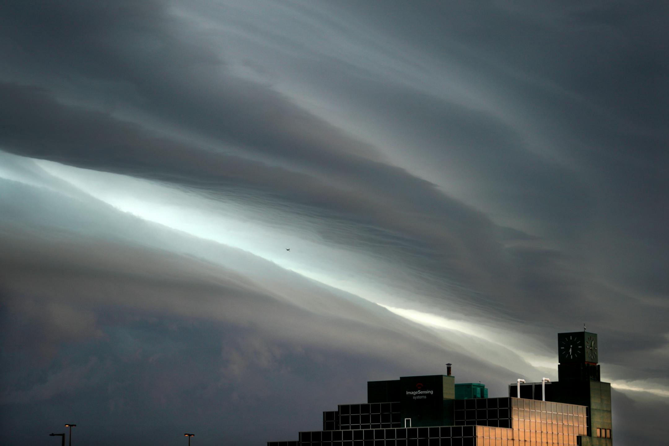 Storm clouds rolled into the Twin Cities Thursday morning creating dramatic formations above the Image Sensing Systems building in St. Paul's Midway area .