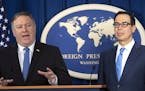 Secretary of State Mike Pompeo, left, and Treasury Secretary Steven Mnuchin, present details of the new sanctions on Iran, at the Foreign Press Center