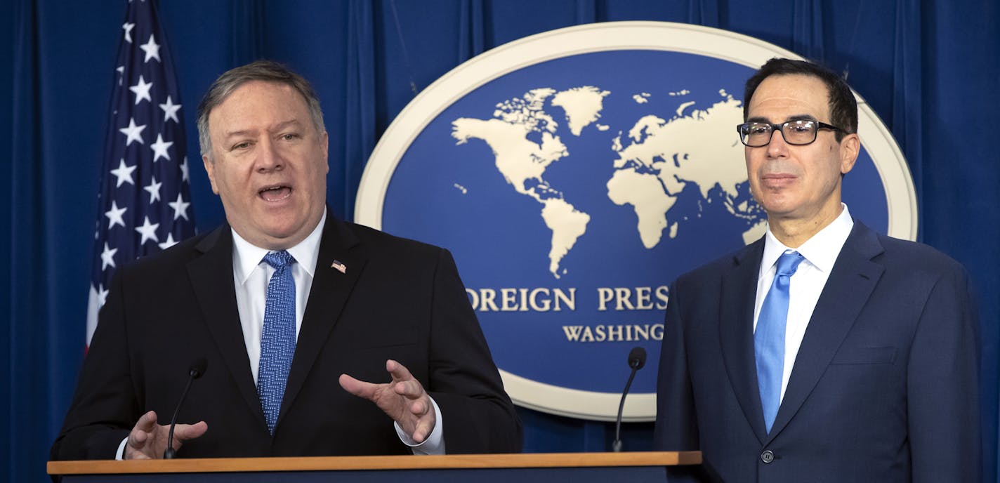 Secretary of State Mike Pompeo, left, and Treasury Secretary Steven Mnuchin, present details of the new sanctions on Iran, at the Foreign Press Center in Washington, Monday, Nov. 5, 2018. (AP Photo/J. Scott Applewhite)