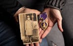 Bob Van Bergen held a portrait of his grandfather Pvt. Albert A. Van Bergen from 1918 while his cousin Jen Moeller cradled the Purple Heart that Alber