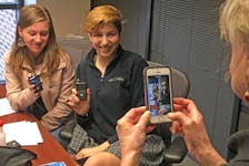 ALLISON SCHOLL, 16, (left) and ELEANOR HEDLUND, 17, pose for a photo at the Park Nicollet International Diabetes Center while holding their new Medtronic MiniMed 670G insulin pumps. Scholl and Hedlund are among the first type 1 diabetes patients in the nation to receive the device, which is the only insulin pump approved in the U.S. to predict how a patientís blood-glucose levels will change over time and then adjust insulin doses in response. ] Joe Carlson - Star Tribune Minneapolis, MN